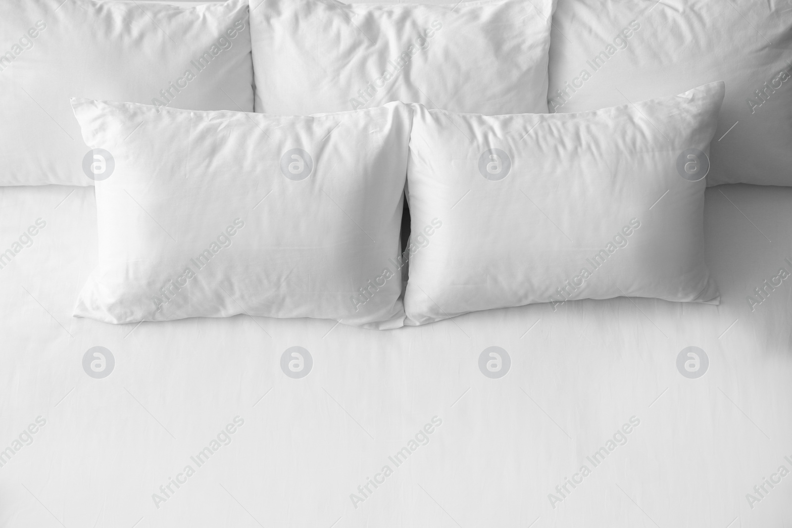 Photo of Soft pillows on comfortable bed, top view