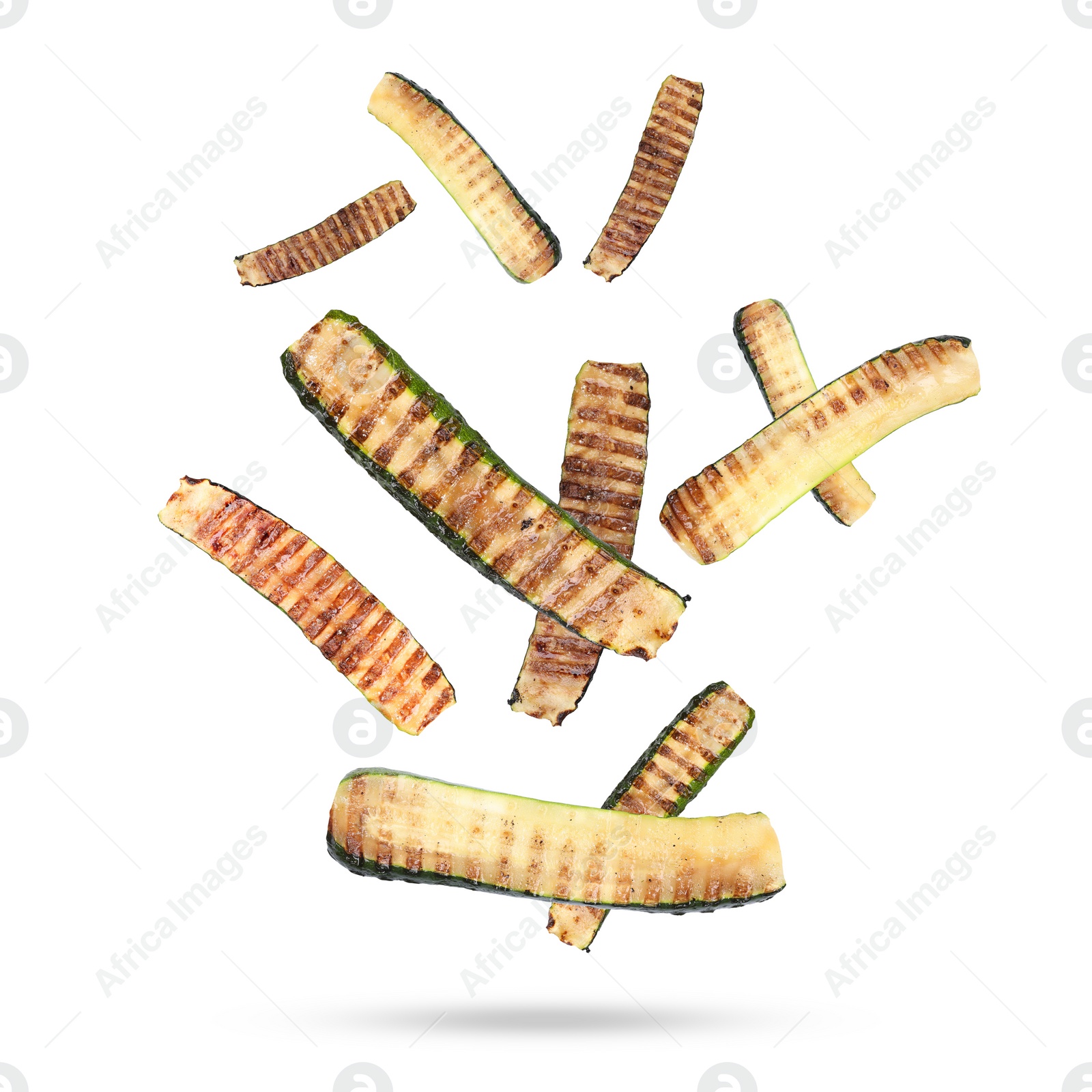 Image of Slices of grilled zucchinis in air on white background