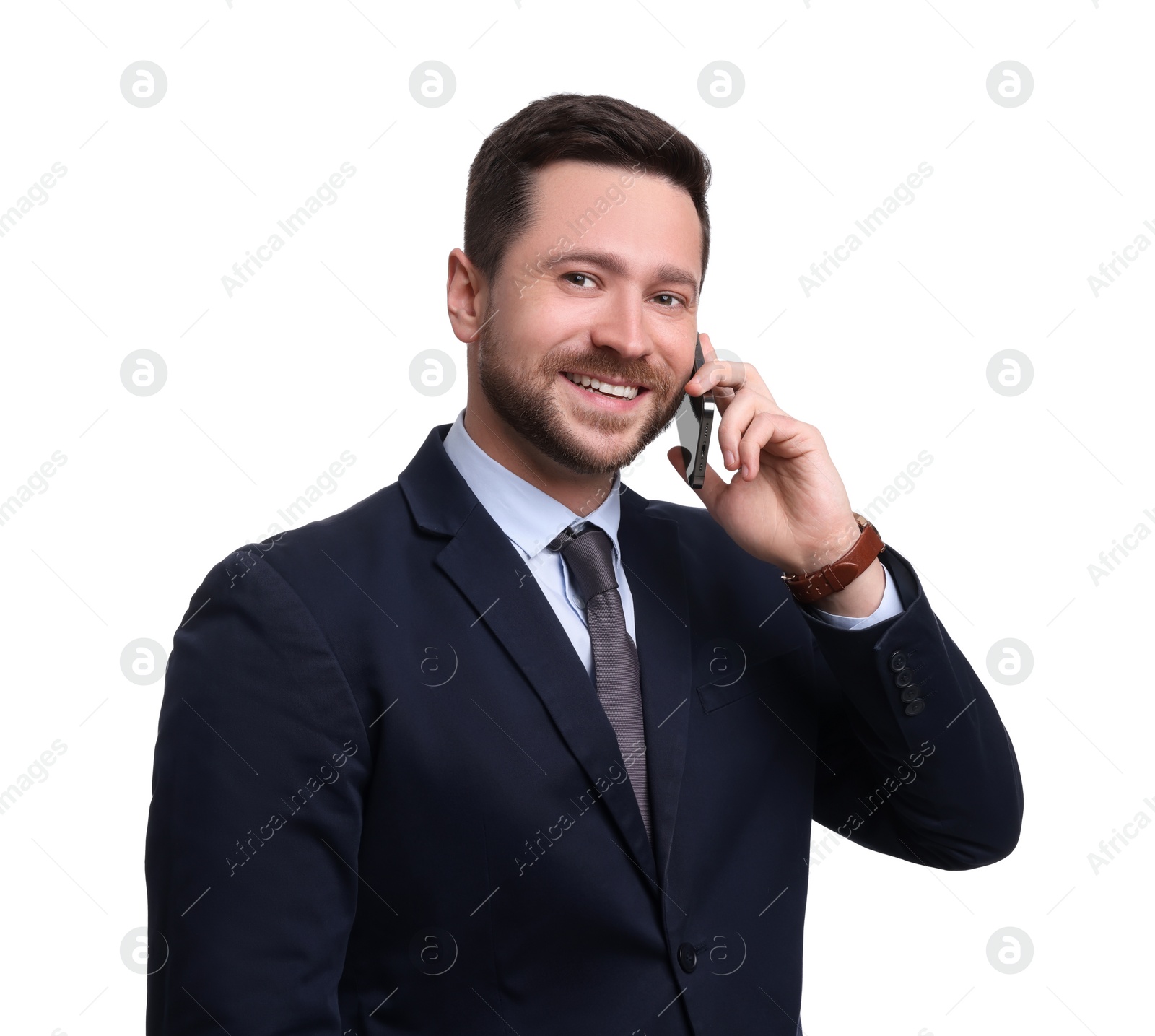 Photo of Handsome bearded businessman in suit talking on smartphone against white background