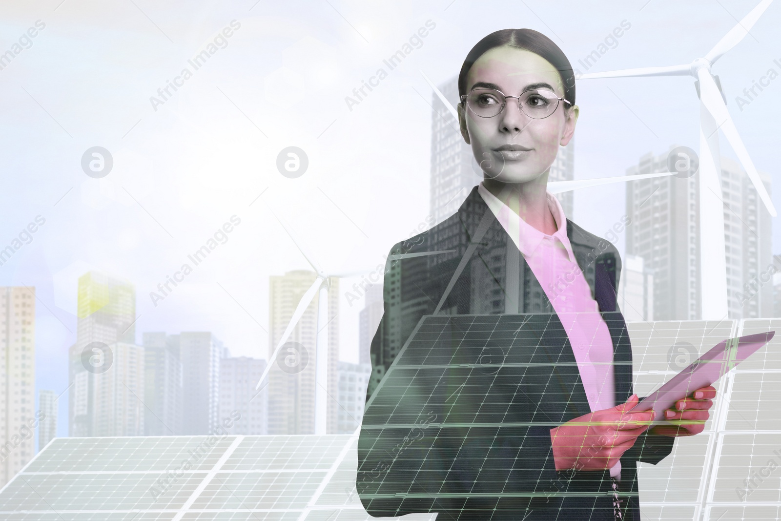 Image of Multiple exposure of businesswoman with tablet, wind turbines and solar panels installed outdoors. Alternative energy source