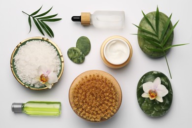 Flat lay composition with different spa products on white background