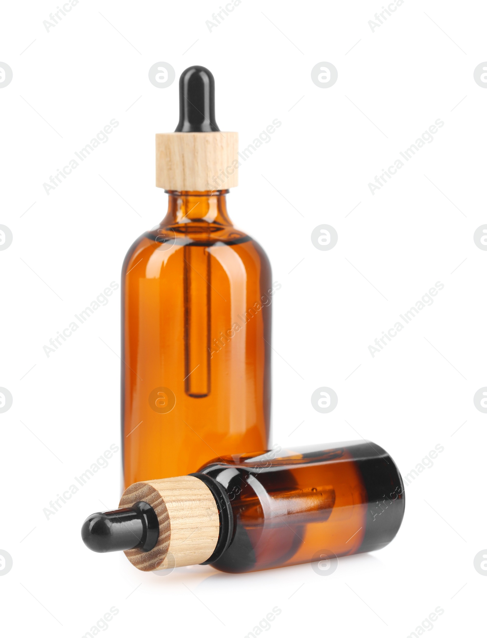 Photo of Glass bottles of tincture isolated on white