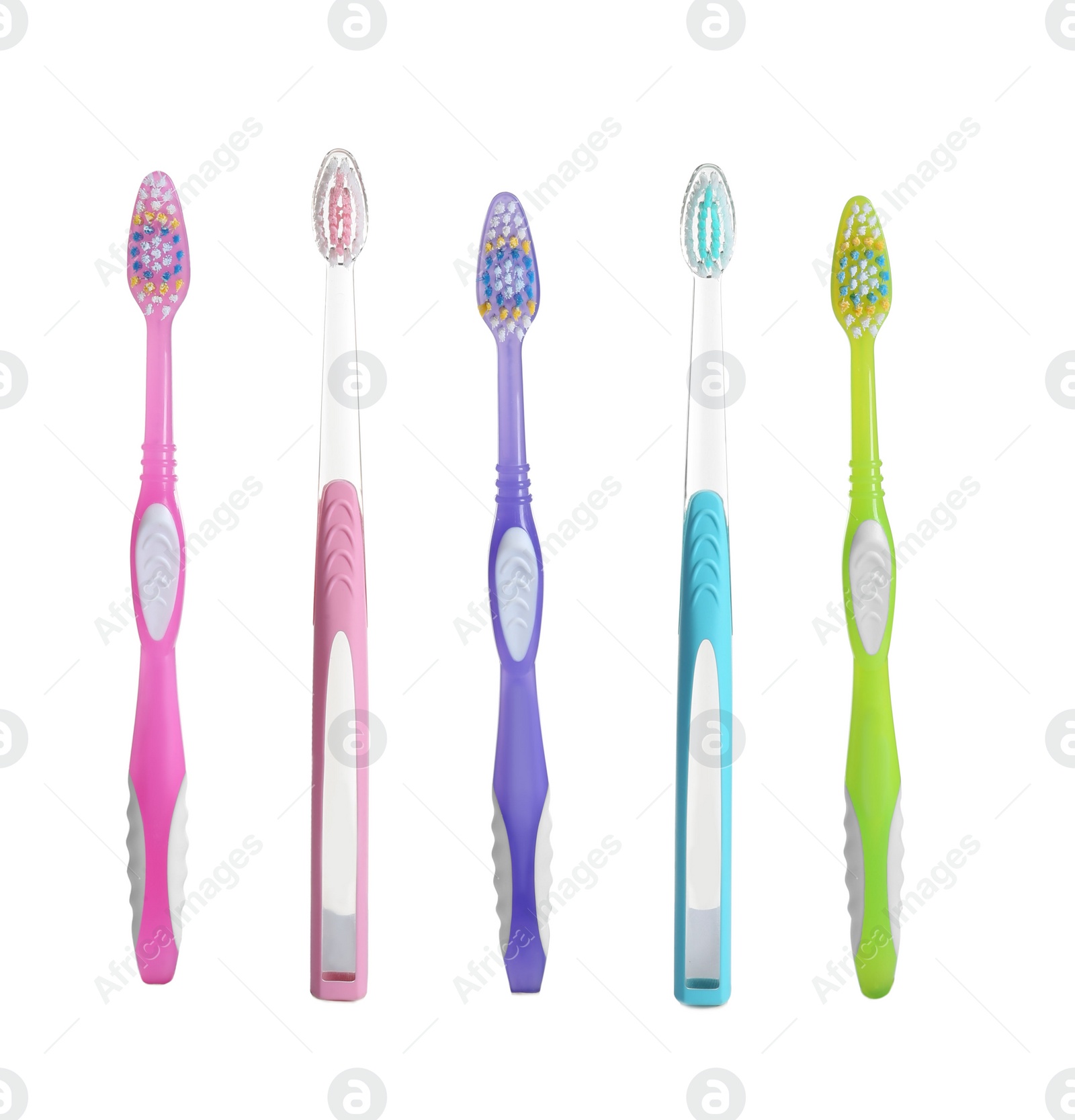 Photo of Different colorful toothbrushes on white background