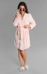 Young woman in bathrobe and sunglasses on grey background