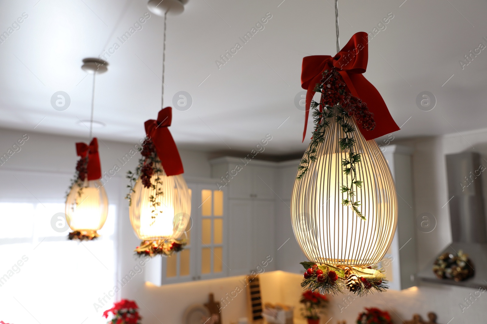 Photo of Hanging lamps decorated for Christmas indoors. Interior design