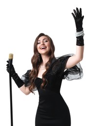 Beautiful young woman in stylish black dress with microphone singing on white background