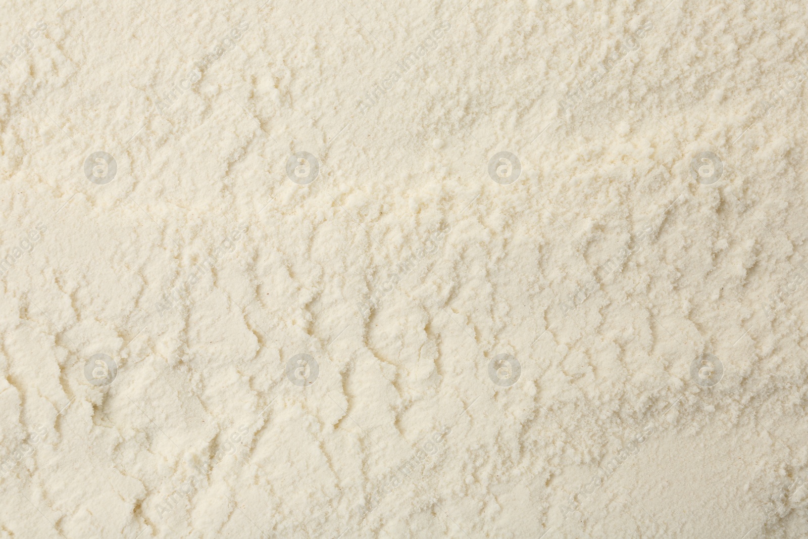 Photo of Texture of baking powder as background, top view