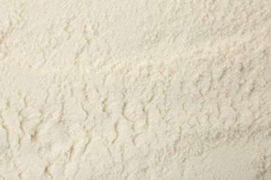 Photo of Texture of baking powder as background, top view