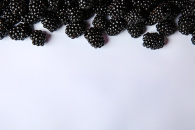 Photo of Composition with ripe blackberries on white background, top view