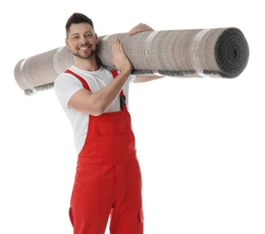 Photo of Male worker with rolled carpet on white background