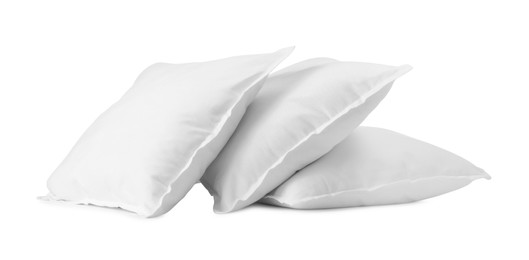 Photo of Three new soft pillows isolated on white