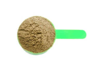 Photo of Scoop with hemp protein powder on white background, top view