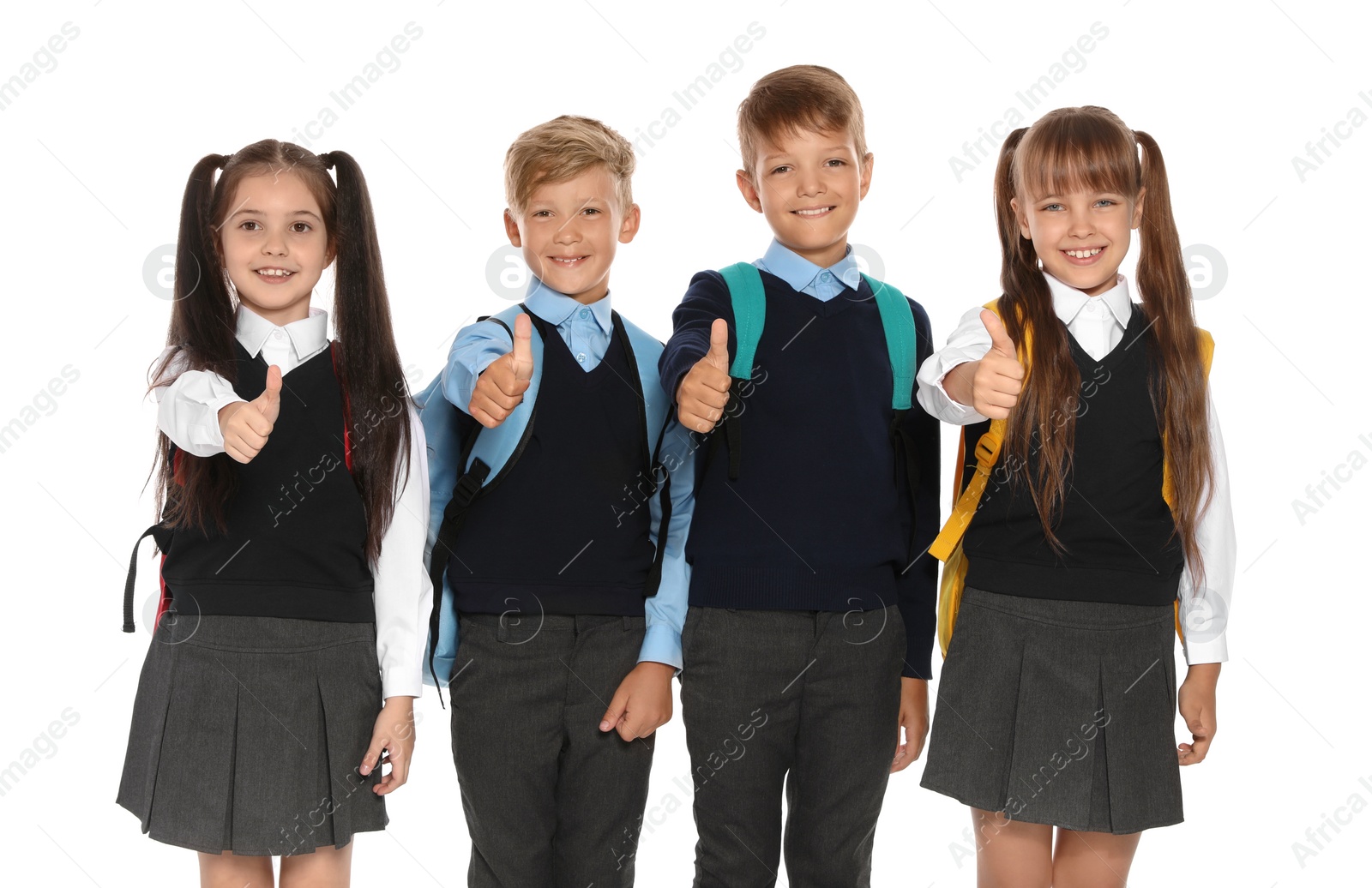 Photo of Little children in stylish school uniform on white background