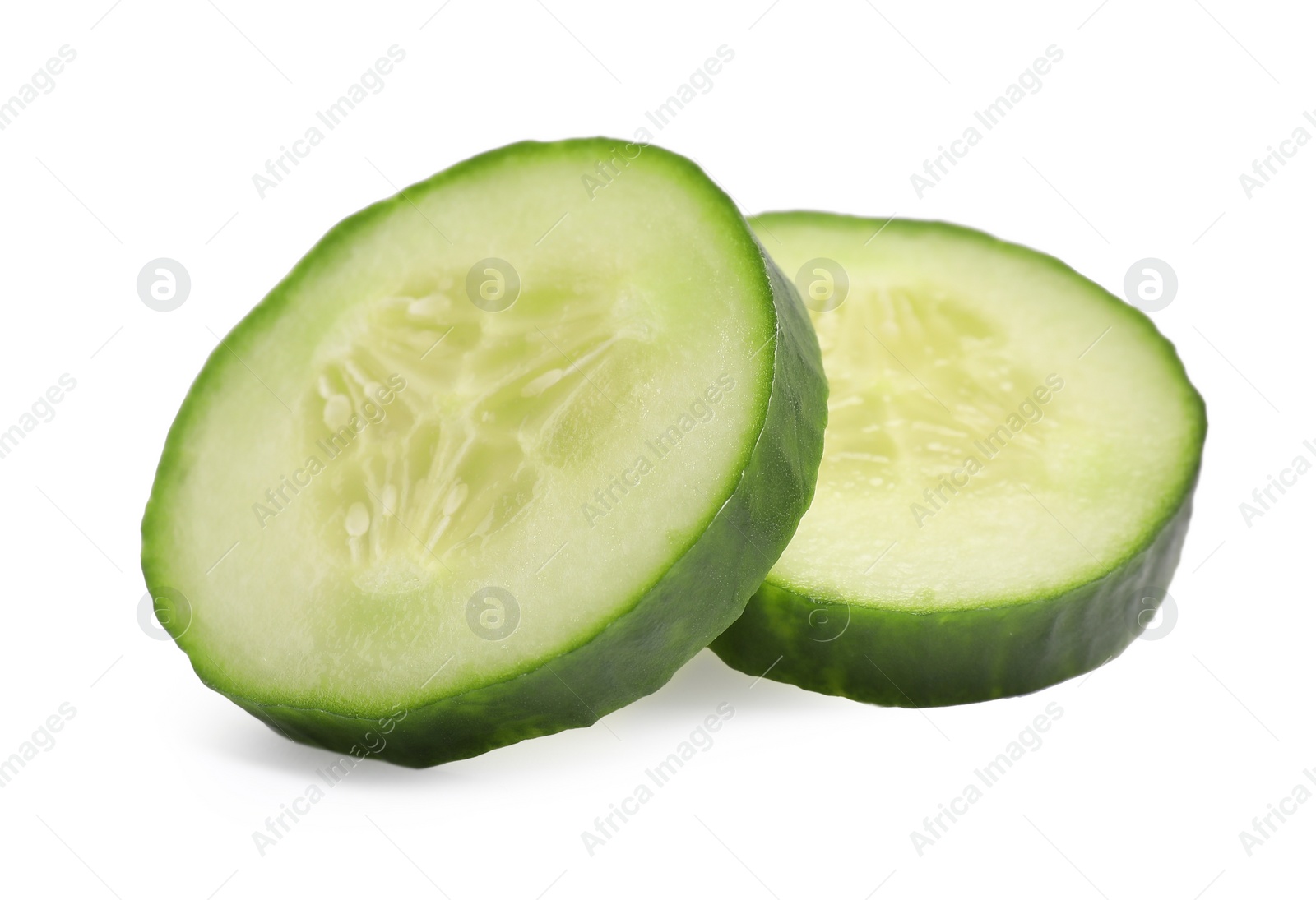 Photo of Slices of fresh cucumber isolated on white