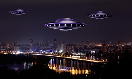 Image of UFO. Alien spaceships flying over night city. Extraterrestrial visitors