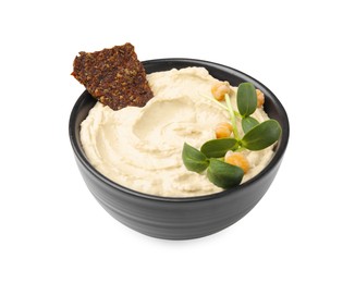 Photo of Bowl of delicious hummus with crispbread and chickpeas isolated on white
