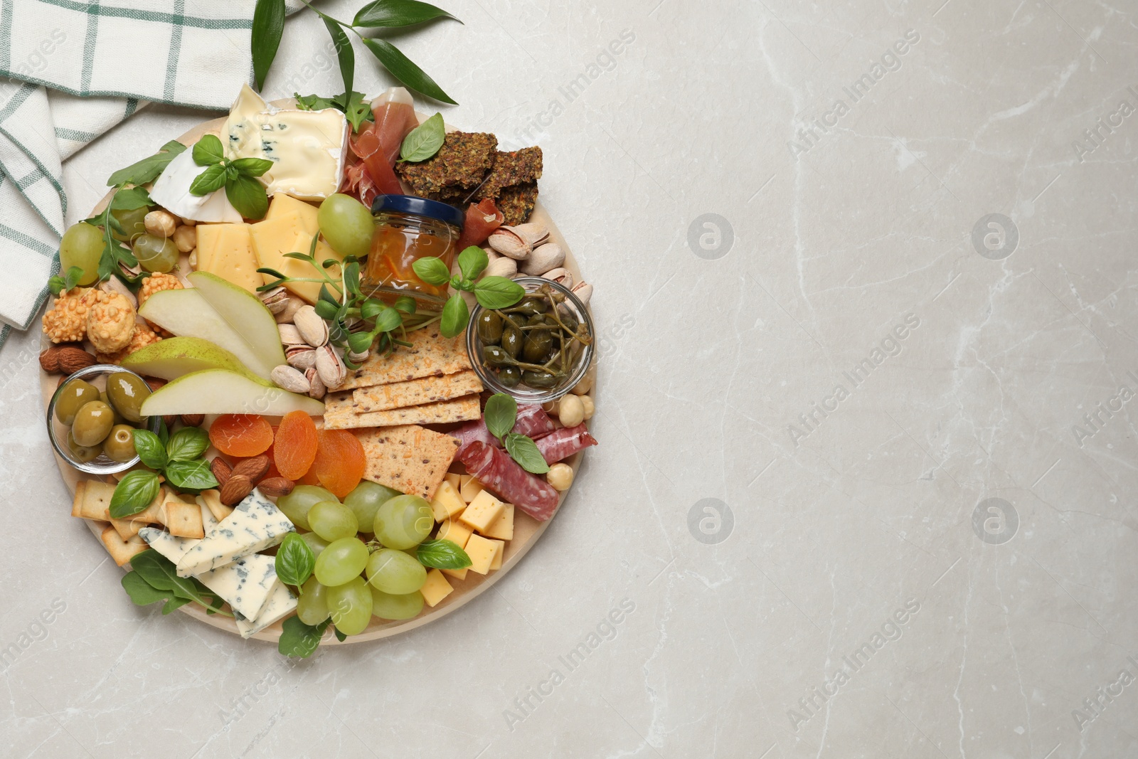 Photo of Different tasty appetizers on light table, flat lay. Space for text
