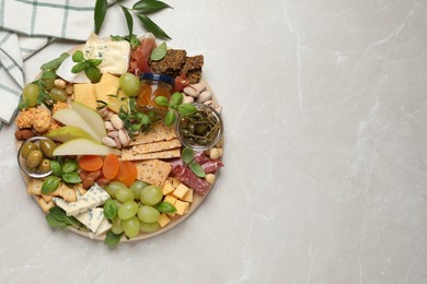 Photo of Different tasty appetizers on light table, flat lay. Space for text