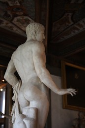 Photo of Florence, Italy - February 8, 2024: Doryphoros statue at Uffizi gallery, low angle view