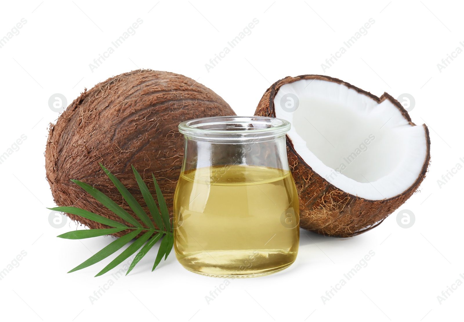 Photo of Organic coconut cooking oil, fresh fruits and leaf isolated on white