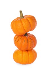 Photo of Stack of fresh ripe pumpkins on white background