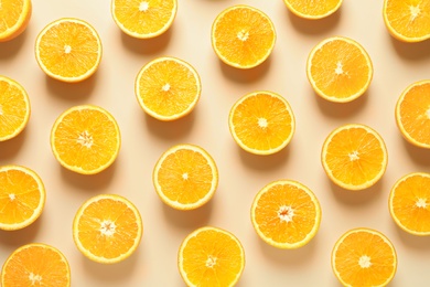 Flat lay composition with ripe oranges on color background