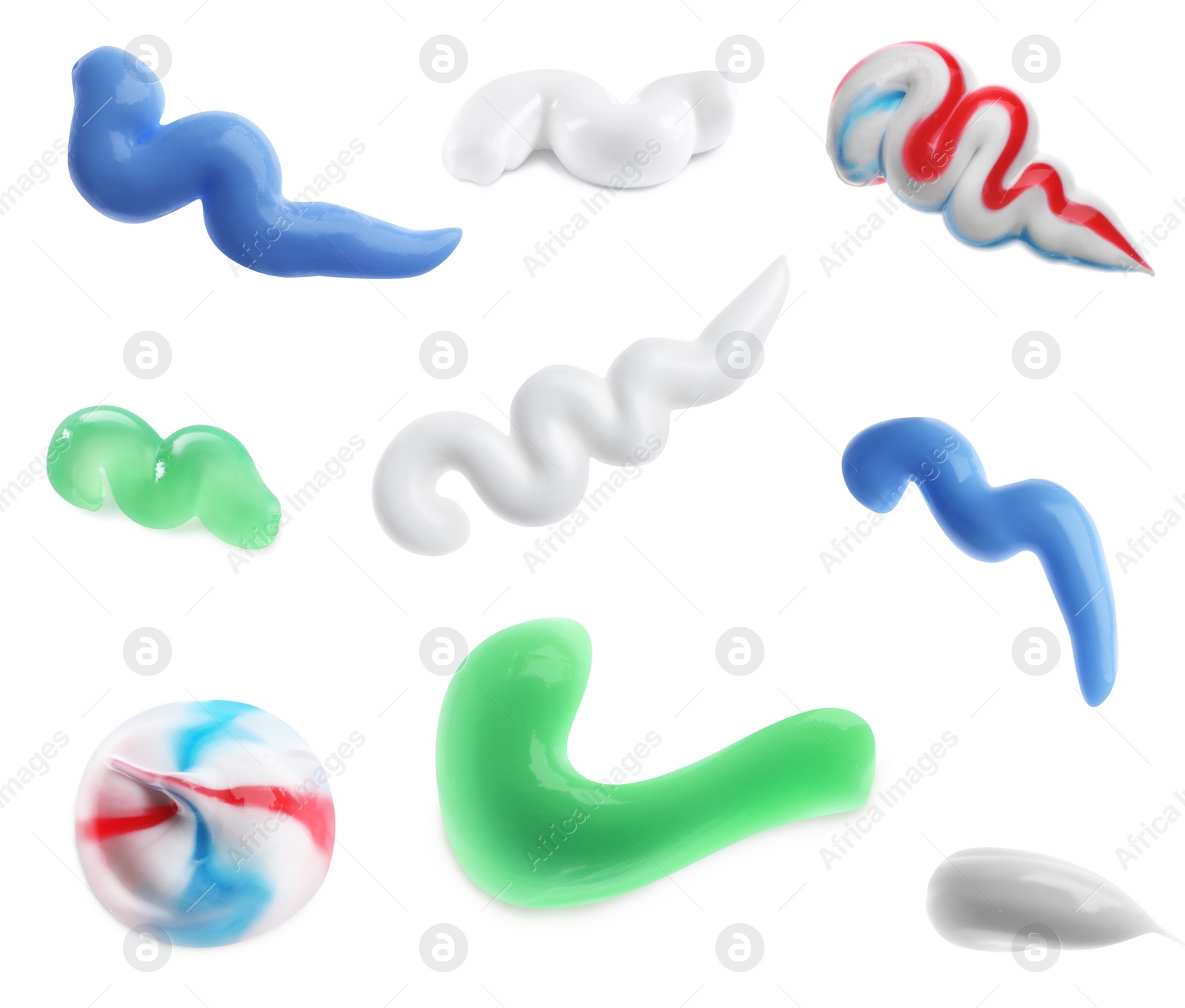 Image of Set with smears of toothpaste on white background