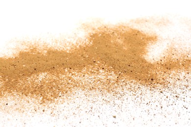 Photo of Pile of brown dust scattered on white background