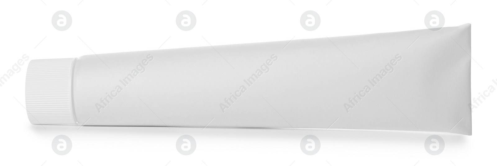 Photo of Blank tube of toothpaste isolated on white