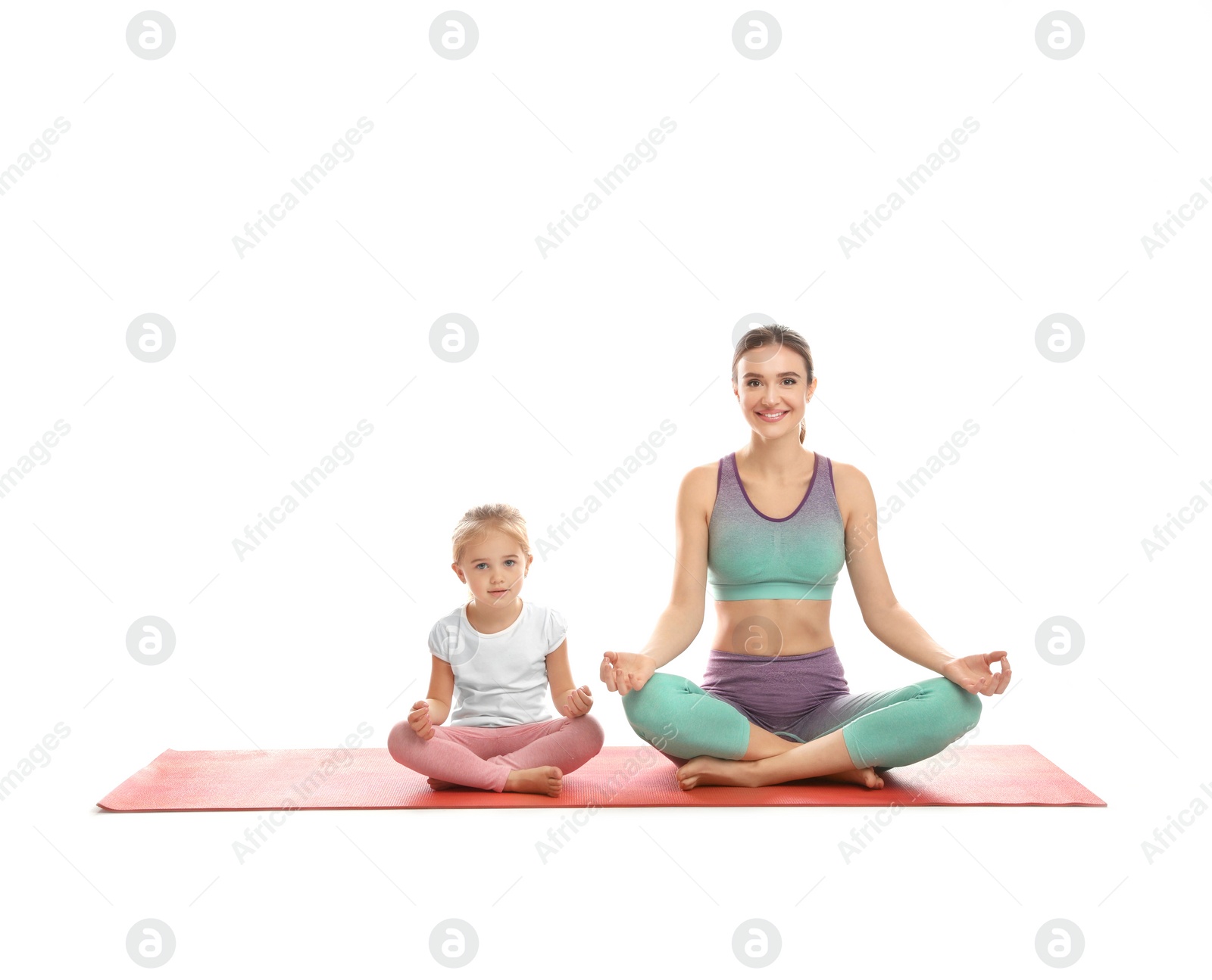 Photo of Young woman and her daughter doing exercise isolated on white. Home fitness