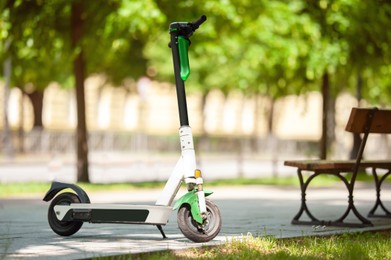 Photo of Modern electric scooter in park. Rental service
