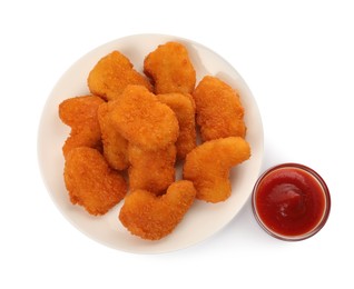 Tasty chicken nuggets with ketchup on white background, top view