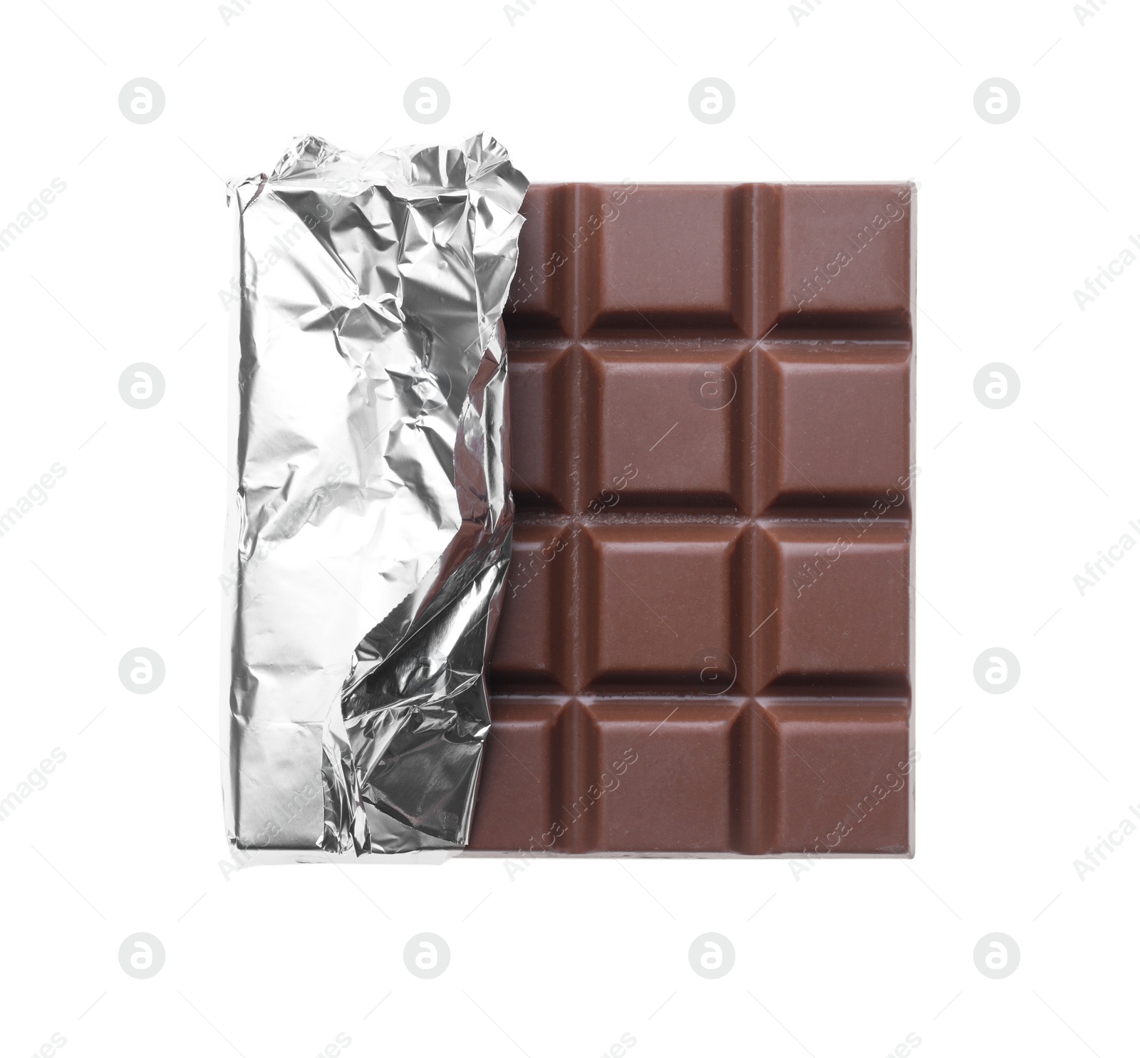 Photo of Delicious milk chocolate bar wrapped in foil isolated on white