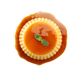 Photo of Delicious pudding with caramel and mint isolated on white, top view