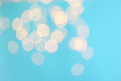 Photo of Blurred view of beautiful lights on blue background
