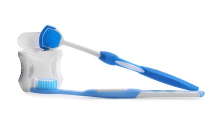 Photo of Tongue cleaner, dental floss and toothbrush on white background