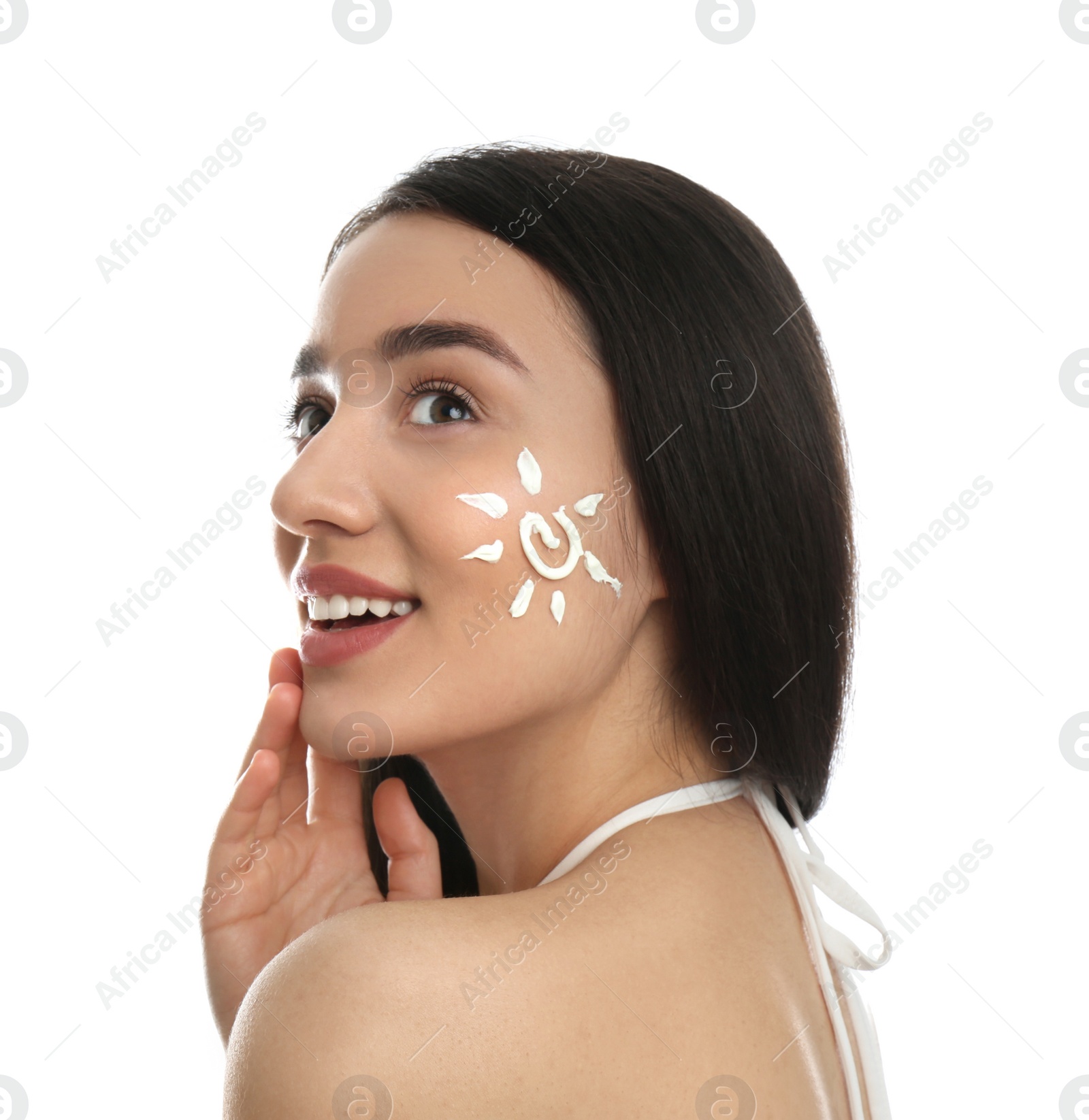 Photo of Young woman with sun protection cream on her face against white background