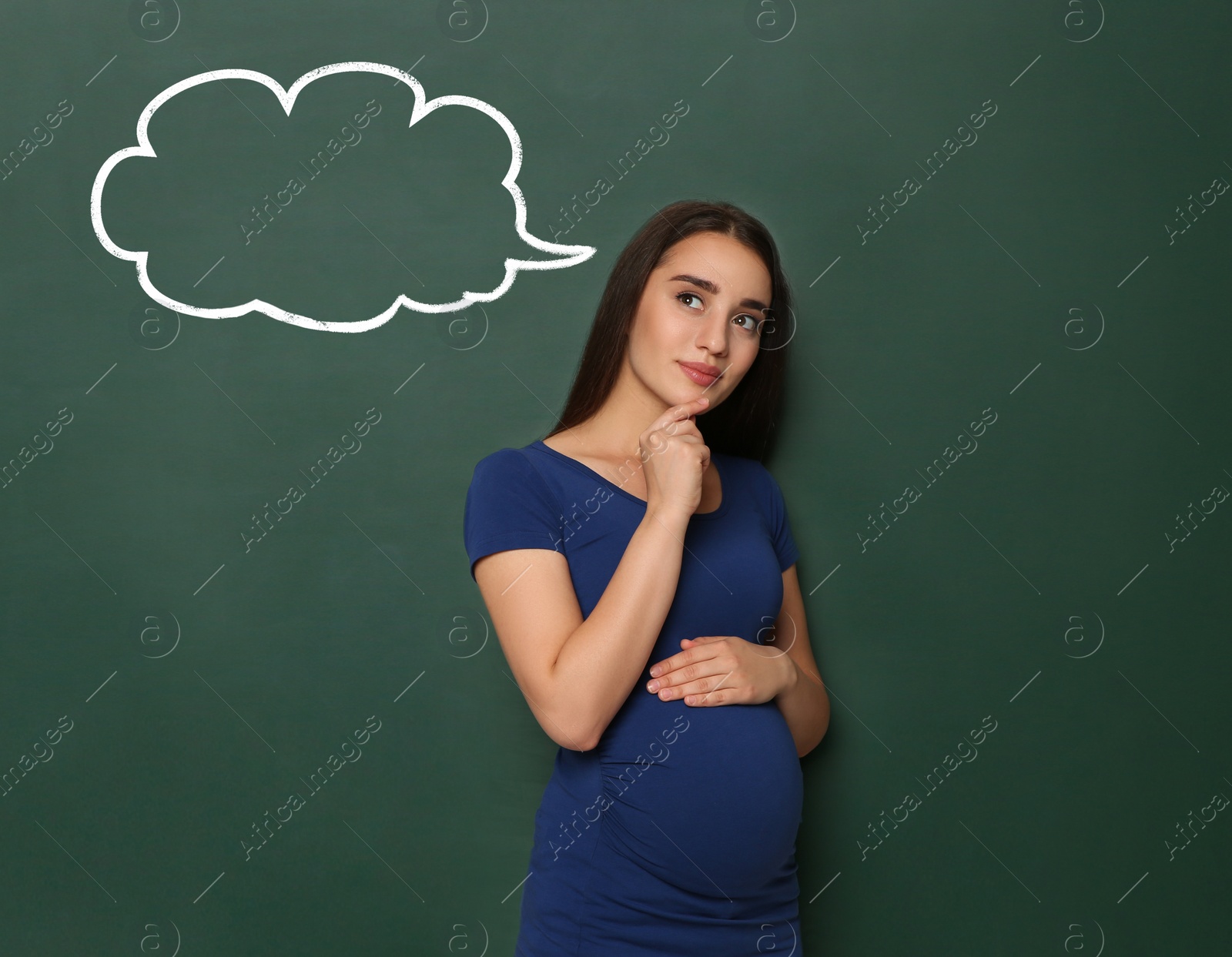 Image of Emotional pregnant woman choosing name for her child. Future mother near green chalkboard with empty thought cloud