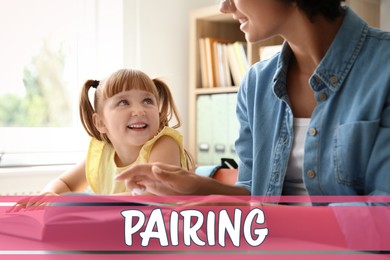 Image of Pairing. Mother helping her daughter with reading book indoors