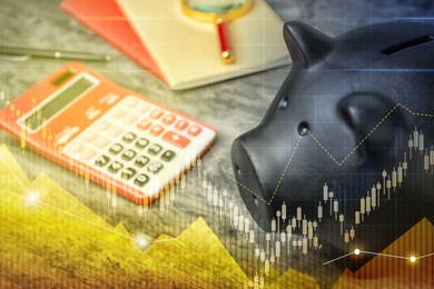 Black piggy bank and calculator on table. Illustration of financial graphs