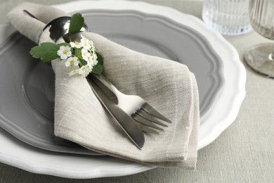 Photo of Stylish setting with cutlery and plates on table, closeup