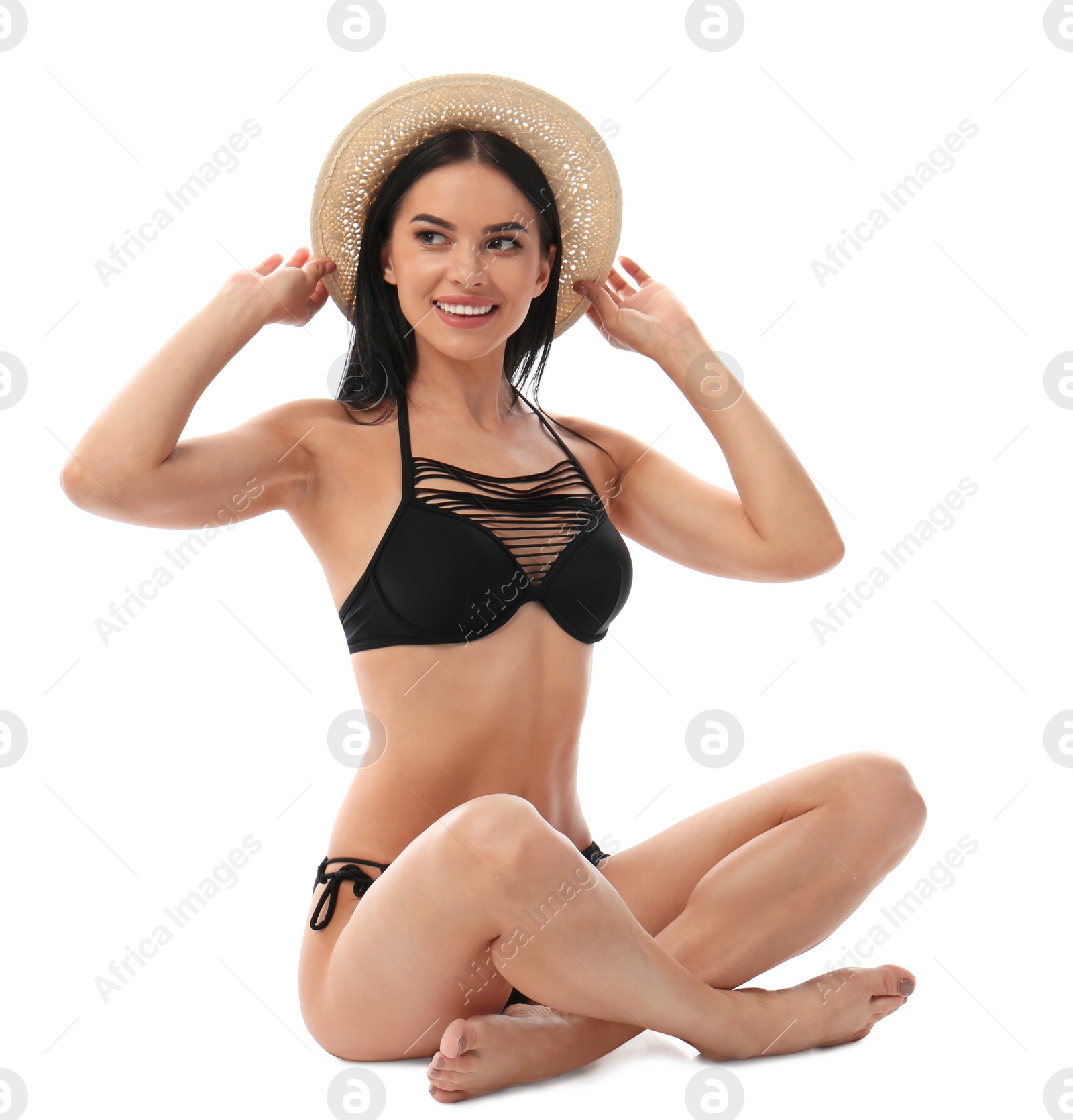 Photo of Beautiful young woman in black bikini with hat on white background