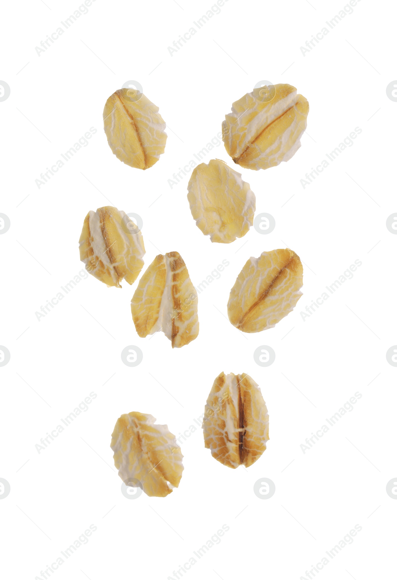 Photo of Dry oat flakes falling on white background