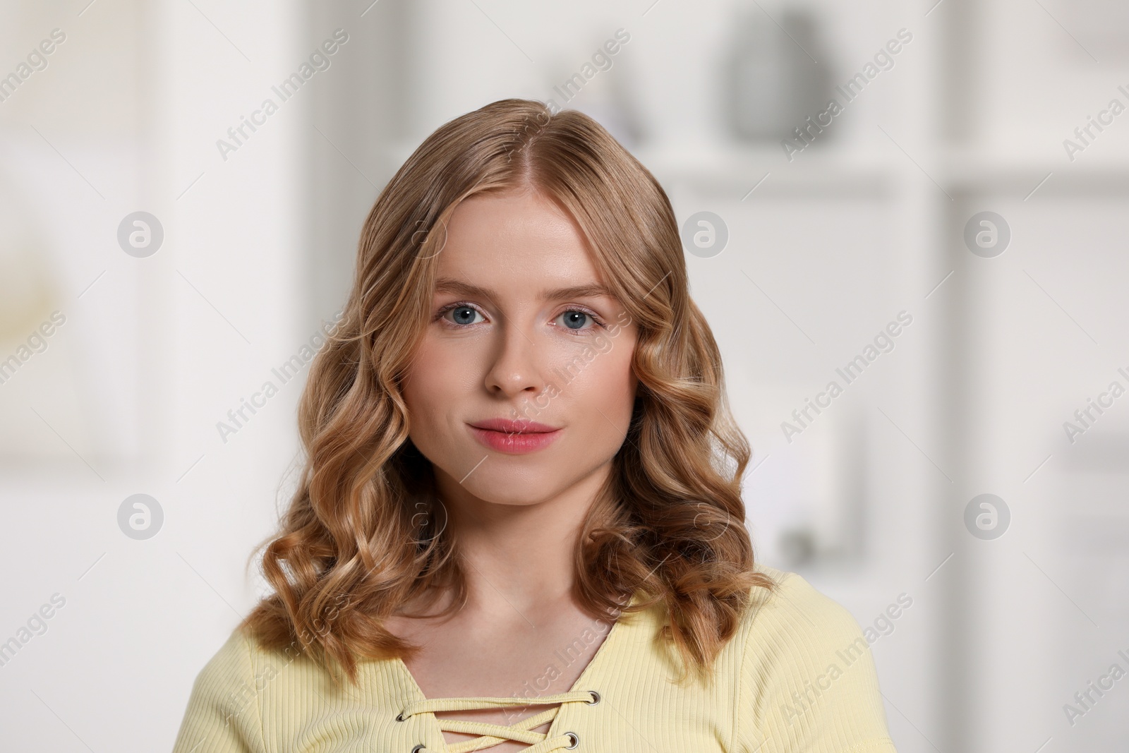Photo of Portrait of beautiful woman with blonde hair indoors