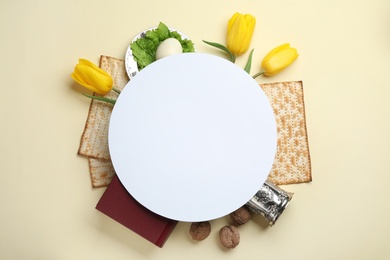 Photo of Frame made with symbolic Passover (Pesach) items and card on color background, top view. Space for text