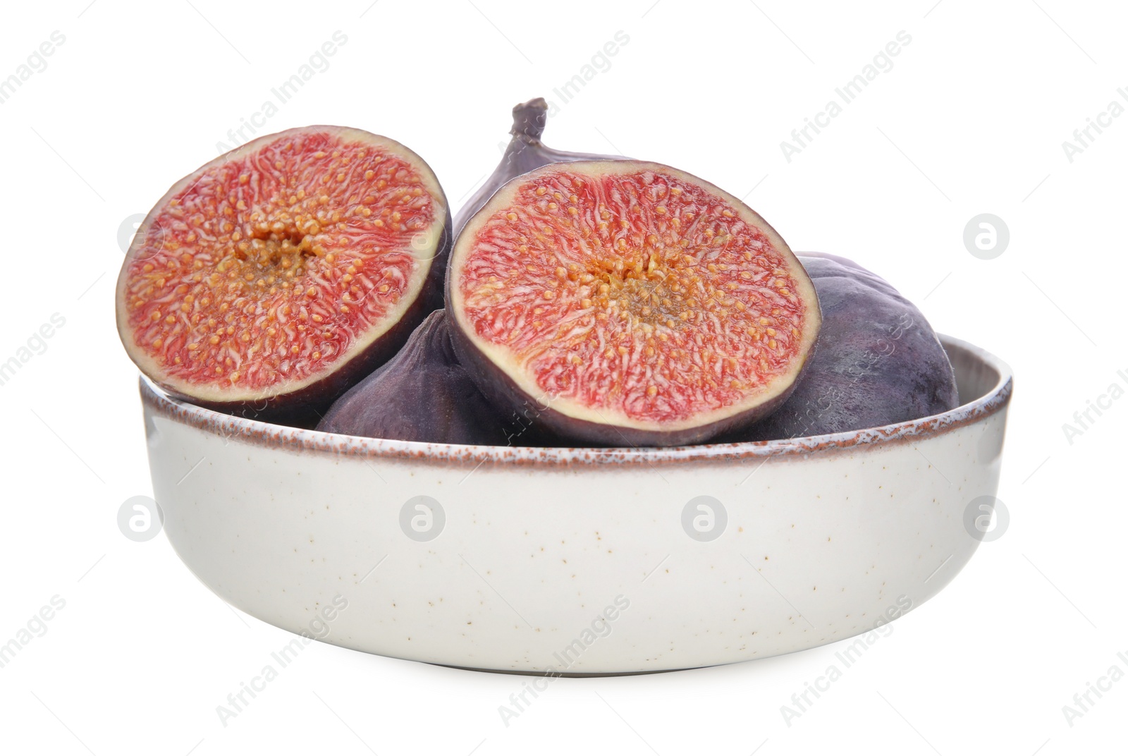 Photo of Whole and cut fresh purple figs in bowl isolated on white
