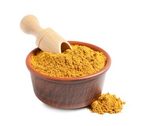 Photo of Curry powder in bowl and scoop isolated on white