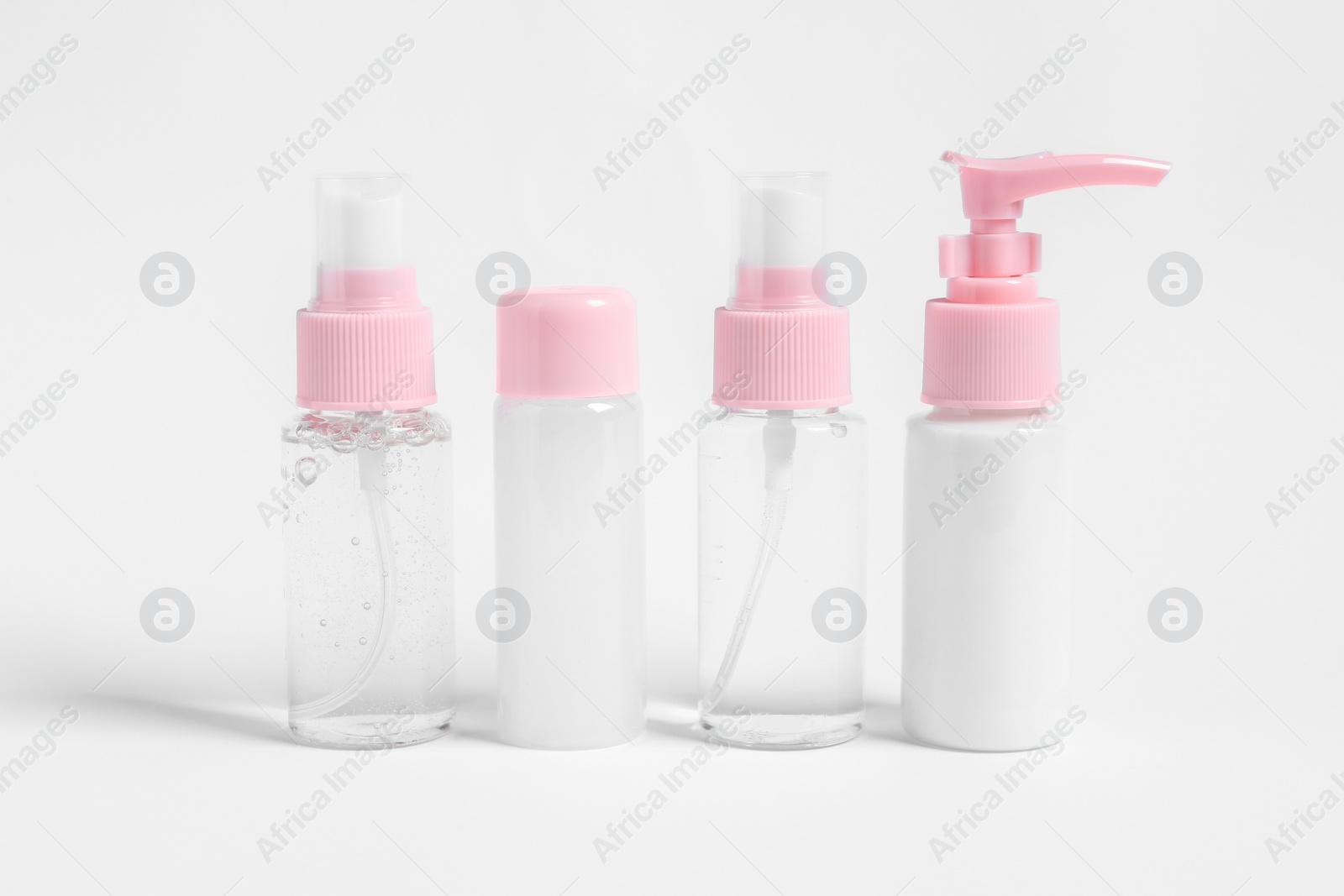 Photo of Cosmetic travel kit with personal care products on white background