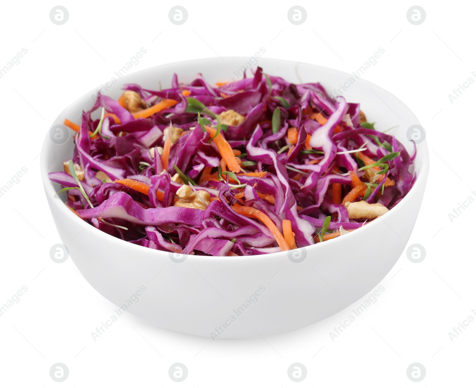 Photo of Tasty salad with red cabbage and walnuts in bowl isolated on white