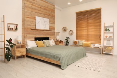 Stylish room interior with big comfortable bed